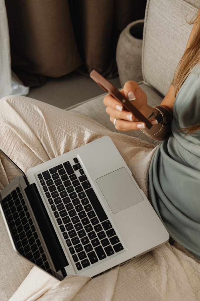 woman on phone with CTA button on health coaching website